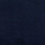 Close-up corner view of tufted navy velvet backrest and seat cushion with button detail