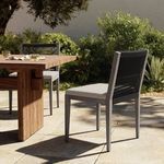 Sherwood Grey chair styled next to wooden outdoor dining table in garden patio setting