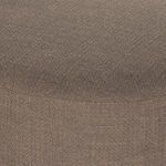 Close-up detail showing fabric weave and curve of chaise seat cushion.
