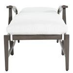 Outdoors angled side view of chaise with white cushions and curved armrests in reclined position