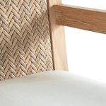 Repetition of detail on woven back panel adjacent to white cushion