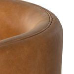Close-up of seat curve and double-stitched piping detail on leather