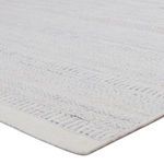 Close-up angled view highlighting textured geometric weave and soft fibers