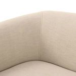 Close-up of sofa's interior corner stitching and rolled arm fabric