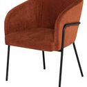 Accent chair with matte black legs and backrest frame, wrapped in smooth terra cotta polyester fabric
