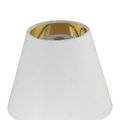 Macro view of polished brass base conical shape with brushed finish and subtle gradient lighting