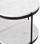 Lower shelve close-up featuring smooth finish of white marble and detail of metal frame joints