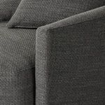 Side profile highlighting rounded backrest and thick cushioned seat with pillows