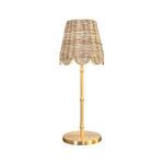 Table lamp with woven rattan scalloped shade and brass base with slim stem