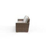 Side profile of Havana Sofa highlighting the wicker armrest and beige seat cushion thickness