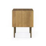 Darker stained version of nightstand styled with books and ceramic vase with greenery