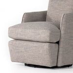 Close-up of armrest and seat fabric showing soft, slightly nubby textured weave