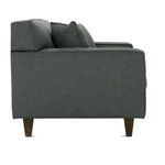 Side profile showing straight armrest and wooden legs of the dark gray Dorset sofa bench cushion