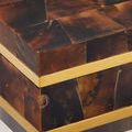 Close-up of box showing the penshell puzzle pattern and seamless brass-finished rim detail