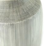Close-up showing slight irregularities in hand-painted line work on lamp neck and base junction.