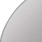 Close-up of top arch with smooth brushed silver edge under glass mirror