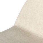 Close-up of seat and lower backrest junction showing fabric texture and seam lines