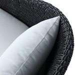 Closeup showing tightly woven black wicker edge detailing on side leg