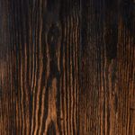 close-up of wood grain showing dark and light patterns in hand-applied distressed finish