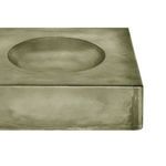 Close-up of textured glass edge and concave indentation with subtle smoky green tint