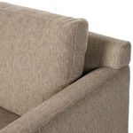 View of removable back cushion resting against arm showing feather fill plushness