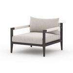 Sherwood chair angled slightly, showing bronze frame and stone grey cushions