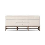Ivory woven raffia texture Fiona Sideboard with five drawers, two cabinets, antique brass hardware, and solid mahogany base