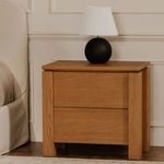 Brook nightstand styled in bedroom with lamp on top and beige bedding nearby