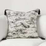 Stonework Throw Pillow styled on light neutral fabric armchair showing toile pattern and tassels
