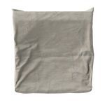 Folded weatherproof chair cover showing smooth fabric and compact square shape