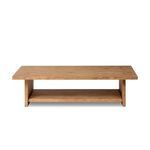 Rectangular coffee table made of distressed light-finished oak with natural knots, paneling, and lower shelf