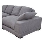 Close-up of right armrest with angled accent pillow on Plunge sectional