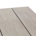 Close-up focusing on center gap between the three wooden planks of the tabletop