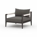 Close front view showing dark fabric texture on seat and back cushions