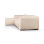 Opposite side profile focusing on fabric texture and curved corner armrest
