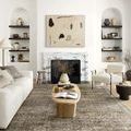 Layla 2'6" X 9'6" rug in antique moss with faded floral and geometric patterns in a living room