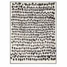 Black Dots Framed Art with irregular black dots on white background, stretched on wooden frame