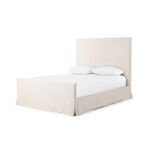 Side profile of queen bed showing linen slipcover and two pillows on white mattress