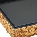 Close-up showing angular edge of open box with smooth black interior and textured gold exterior