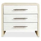 Front view highlighting three soft white chalk finish drawers with champagne bar-pull hardware on lacquered burlap finish ...