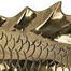 Extreme close-up of raised dorsal fin and detailed scale texture on brass fish sculpture