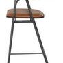 Side profile of Gianni Counter Stool highlighting slim black metal legs and armrest design with leather cushioning