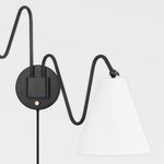 Gold Onda sconce circular mount and arm with macro focus on textured matte white shade