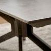 Close-up of rounded edge of ash gray concrete top showing smooth texture