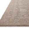 Close-up angled view showing rug’s low, velvety pile and subtle border pattern