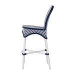Side profile of chair showing curved backrest and cushioning with navy and white weave