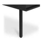 Close-up of slender black cylindrical metal leg with floor protector pad