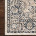Close-up of Teagan rug border on dark hardwood floor highlighting textured pattern.