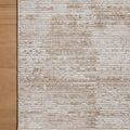 Close-up of flat Townes Sand Beige rug edge on light wood floor showing subtle tonal pattern and neat binding