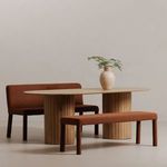 Place Dining Banquette styled in a minimal room setting with matching bench and wooden dining table